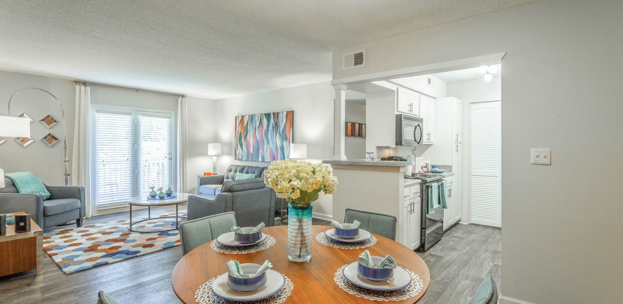 Hawthorne at Lily Flagg apartment dining area with a round dining table and chairs