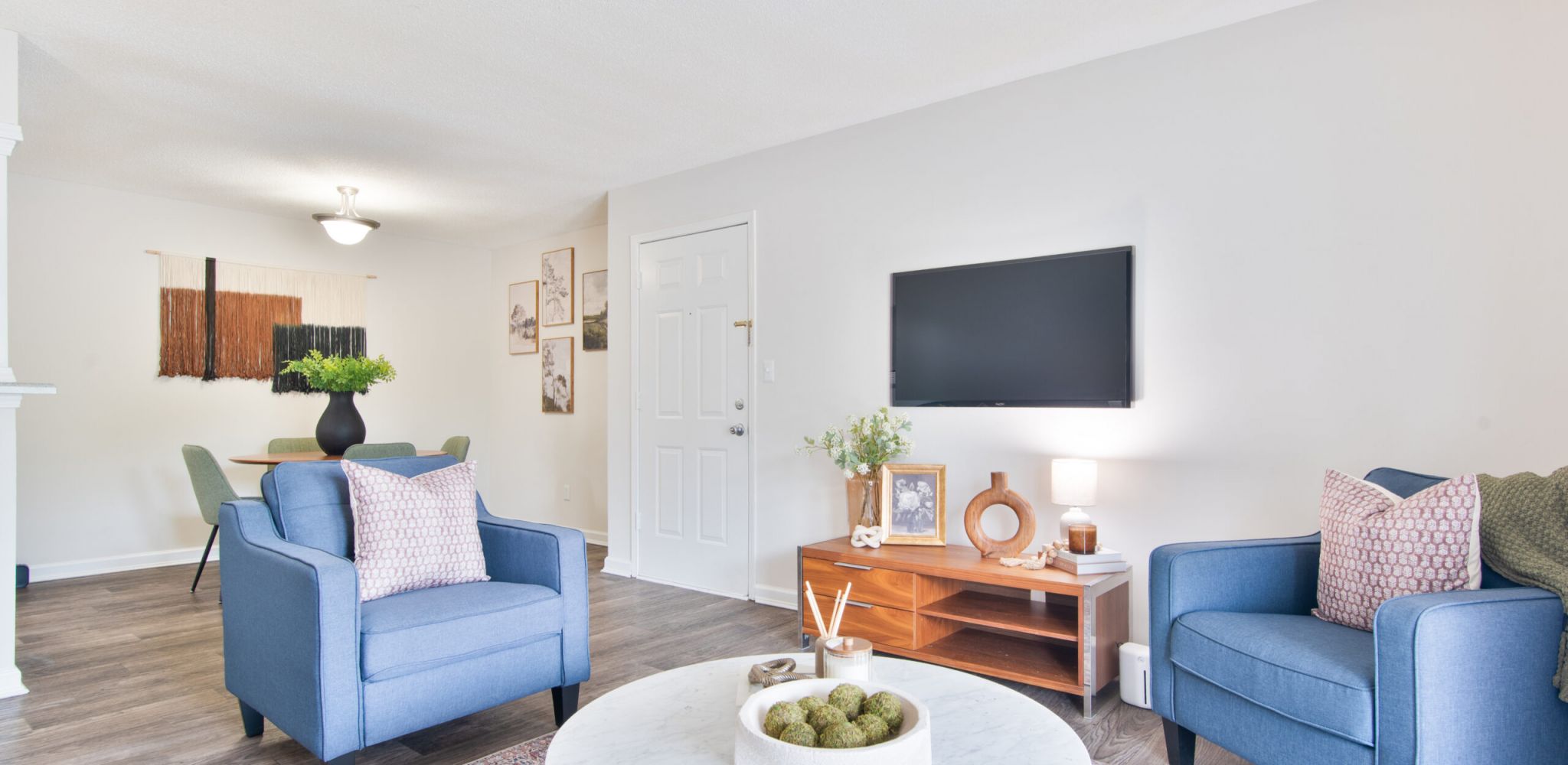 Hawthorne at Lily Flagg apartment dining area with a round dining table and chairs